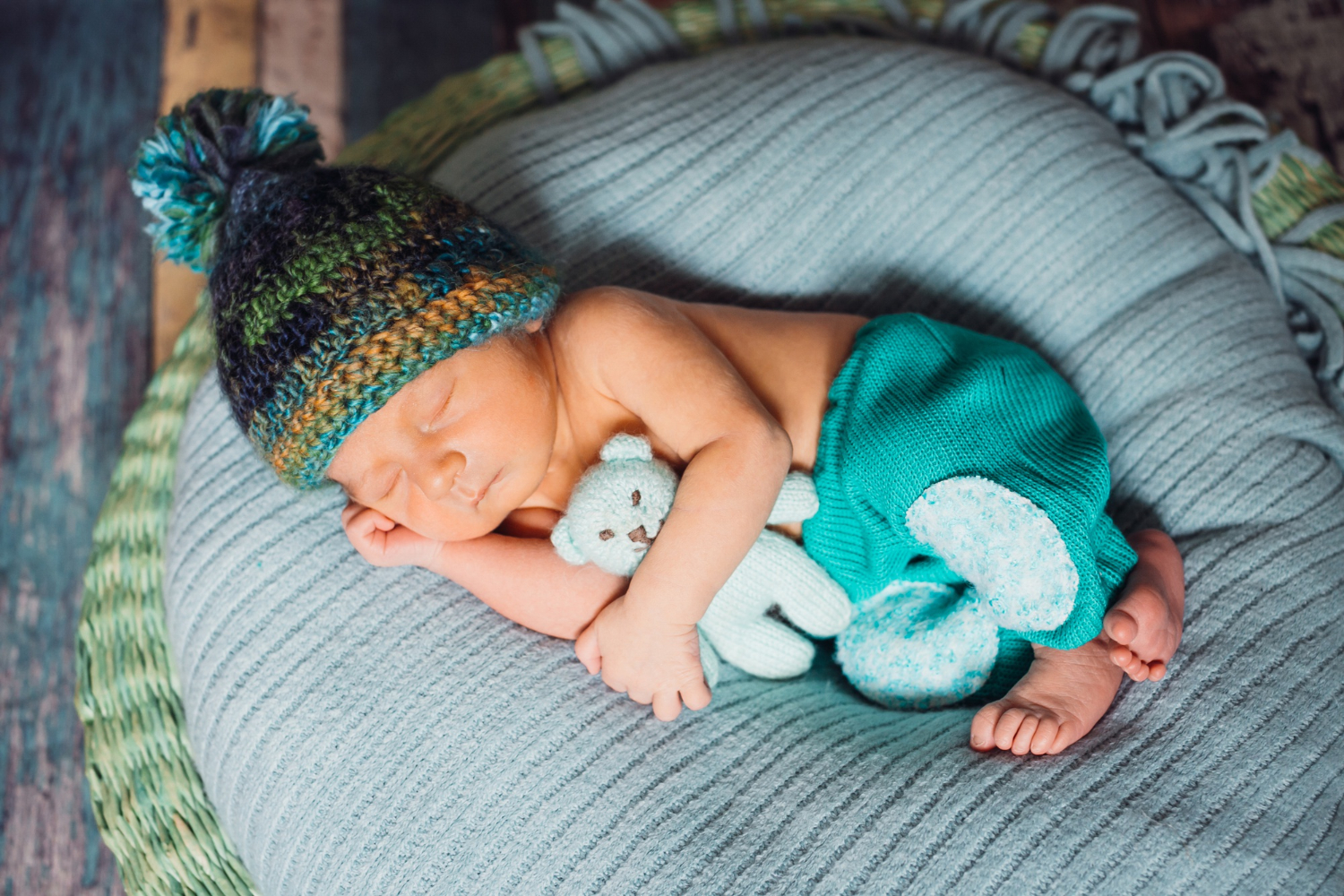  Sleeping newborn on a neck pillow, a cozy baby shower gift idea