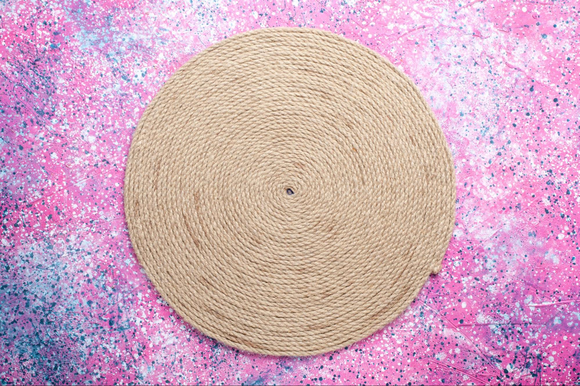 Circular travel changing mat on a vibrant background, a handy baby shower gift idea