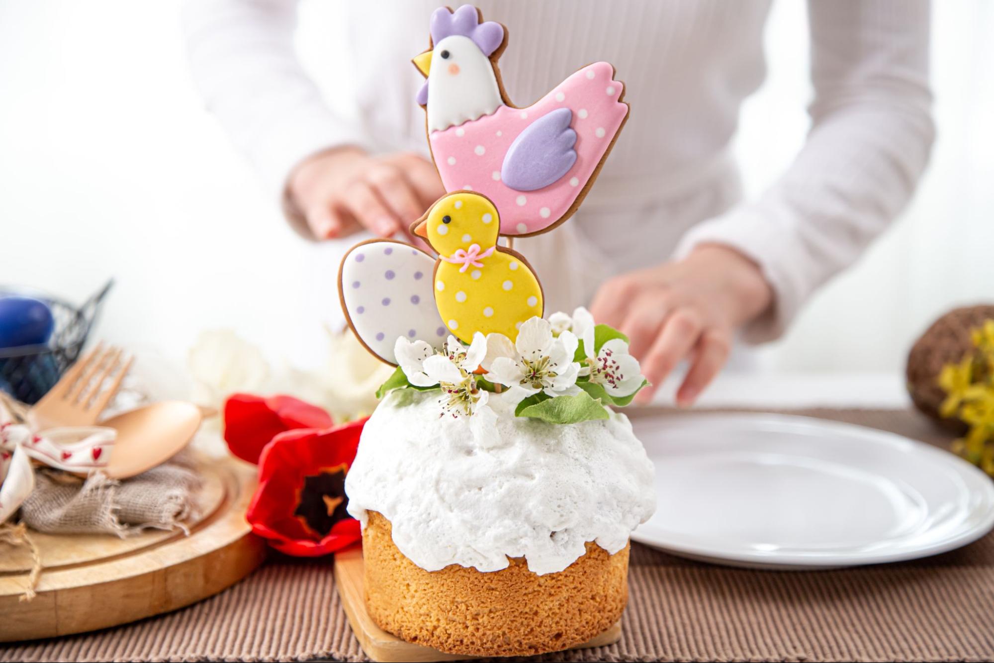 Easter-themed diaper cake with cookie toppers for a baby shower gift idea