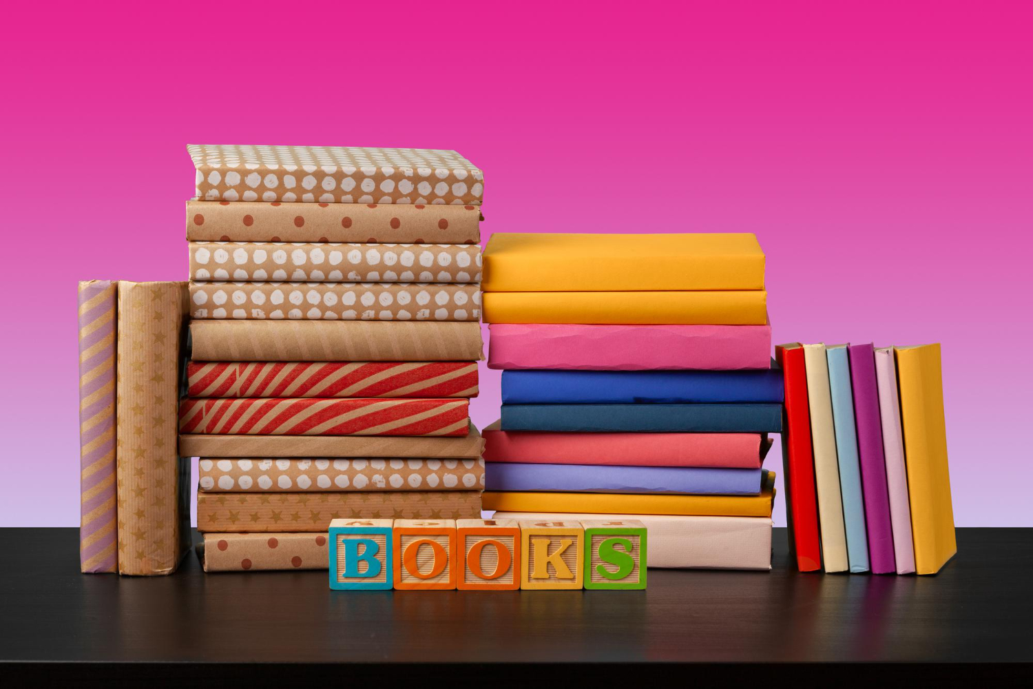 Colorful stacked books and blocks spelling 'BOOKS', great baby shower gift idea