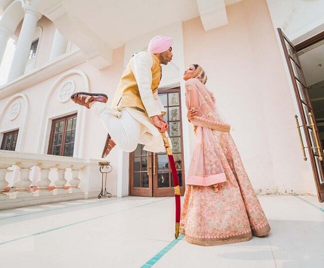 Quirky wedding couple photo pose