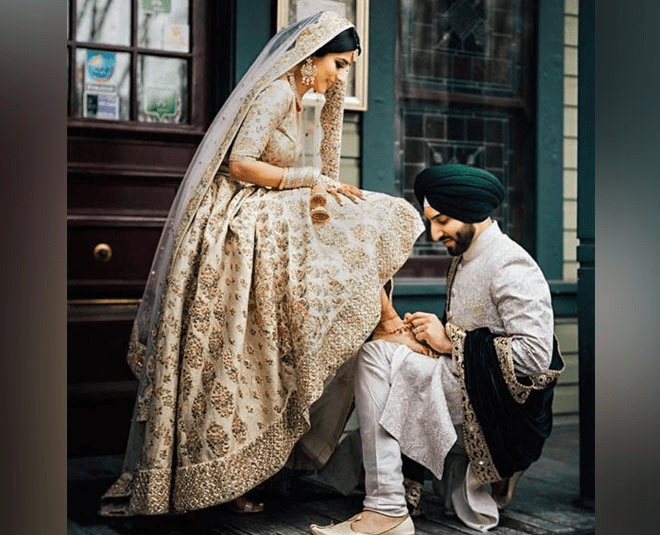 Candid Couple Shot - Bride in Interesting Lehenga and Groom in a  Traditiona… | Indian wedding photography couples, Wedding couples  photography, Indian wedding poses