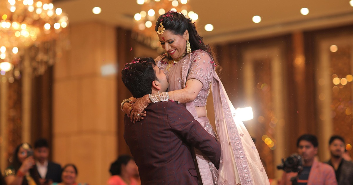 playful lift wedding couple pose fun candid wedding photography