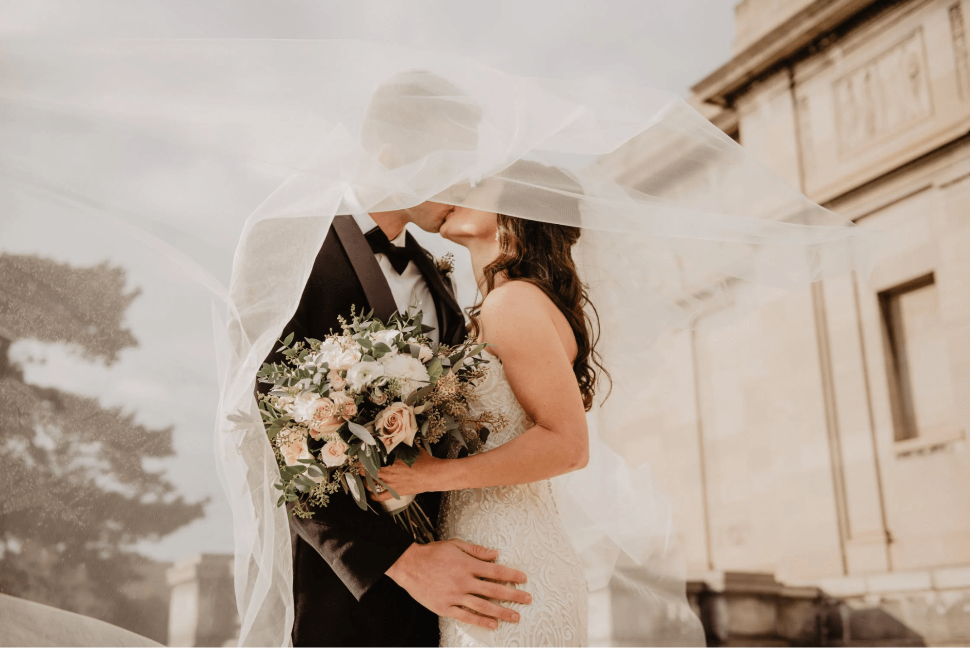 A romantic bride’s veil photo pose 