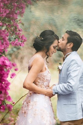 Forehead kiss couple wedding pose