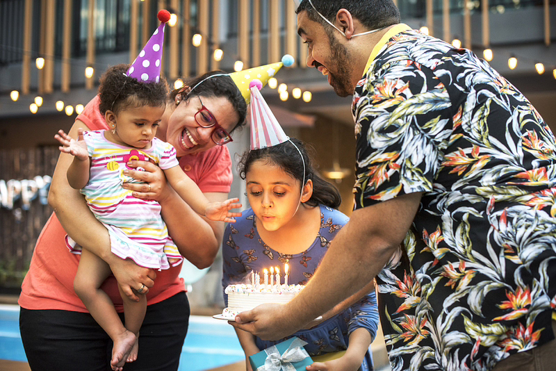 Children and parents in a themed birthday party