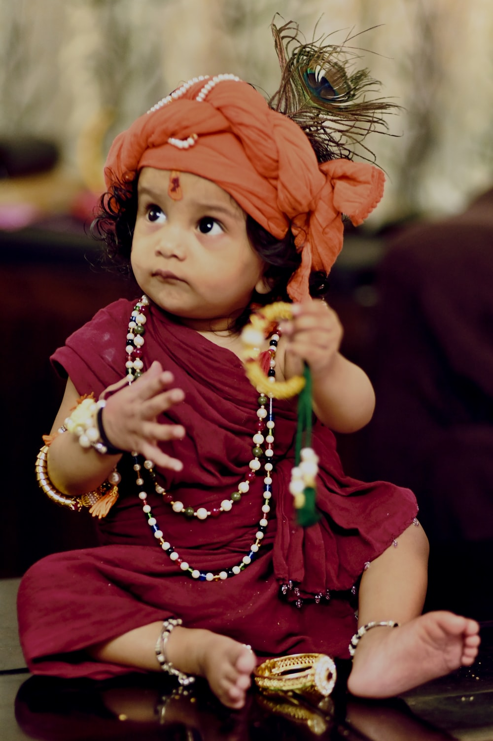 Baby dressed in a traditional outfit.