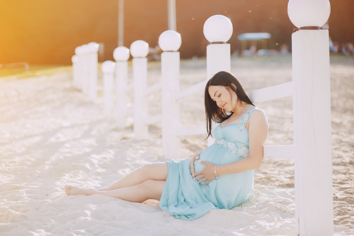 Beach pose at baby shower, embracing the coastal bliss and anticipation of a little one. 