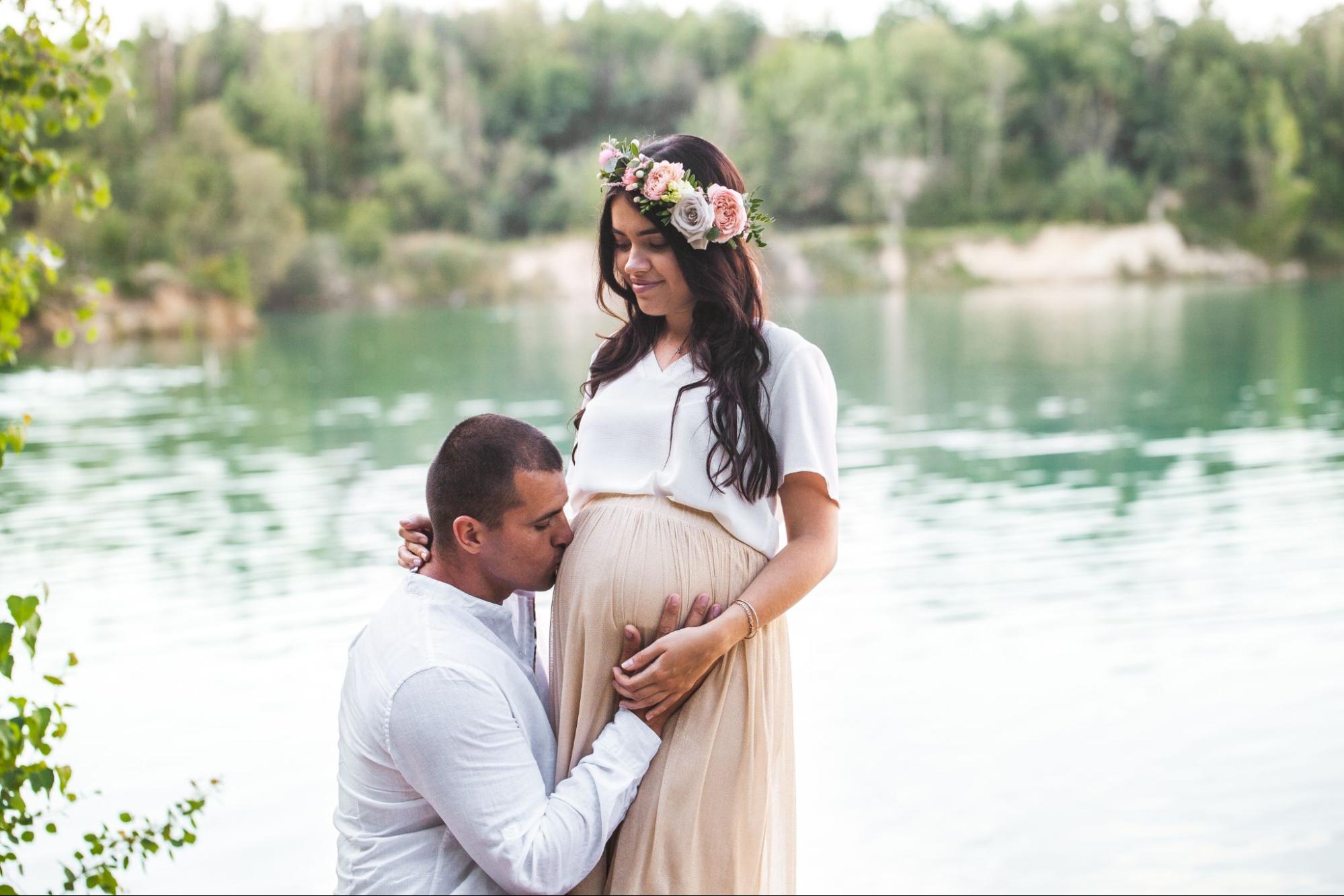 Belly kiss pose at baby shower, a sweet moment of affection and anticipation.