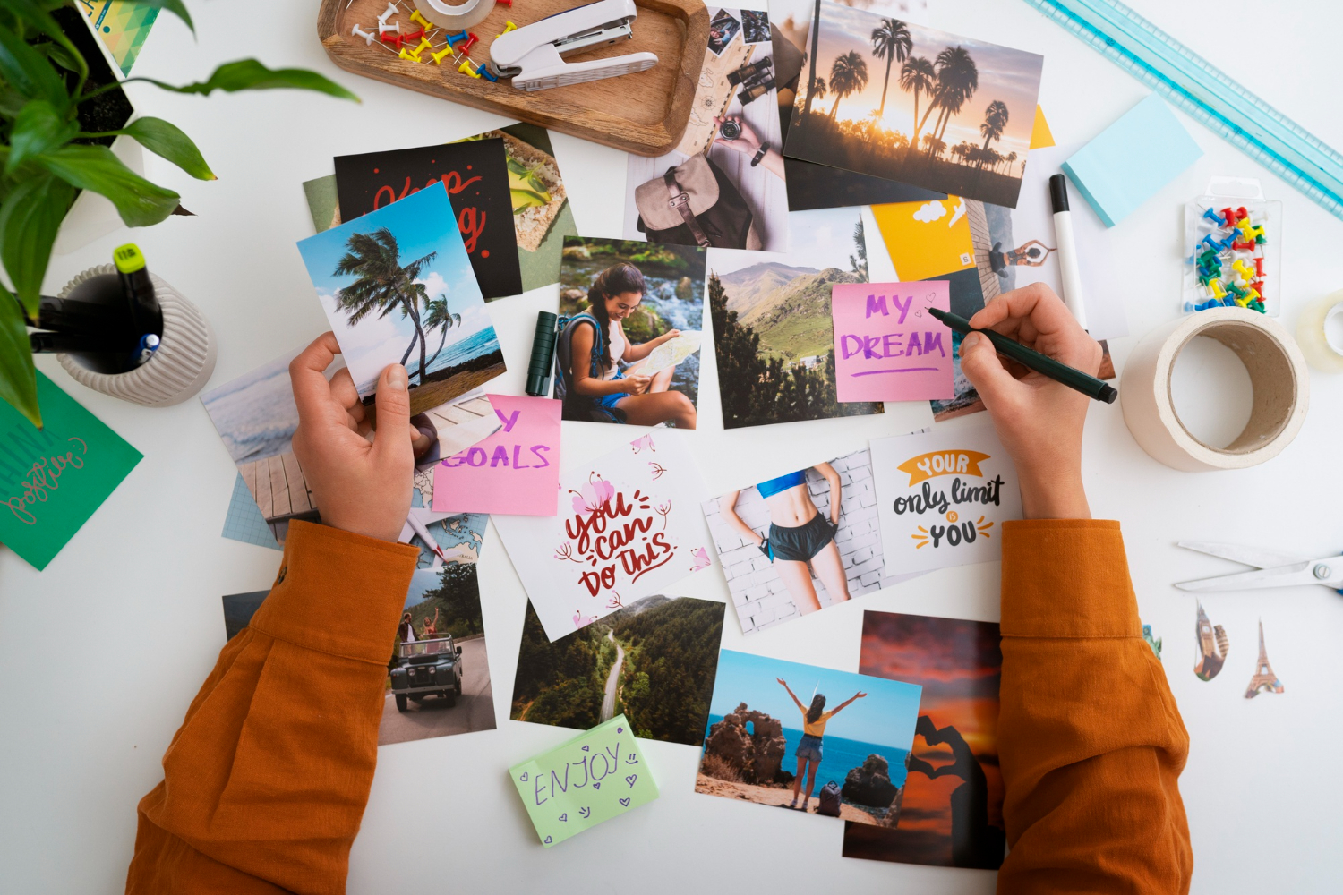  Celebrate love with personalized photo puzzles! A woman's hands hold a stack of photos on a table, ready to be turned into a unique marriage anniversary gift