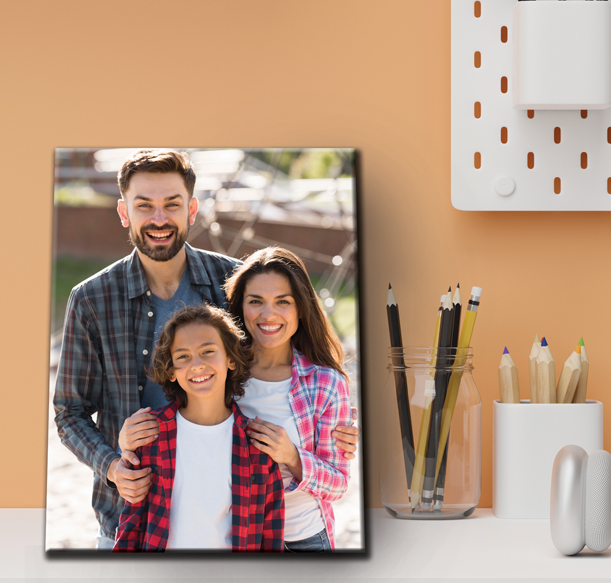 A heartwarming family photo displayed on a wall, accompanied by a desk and a pencil