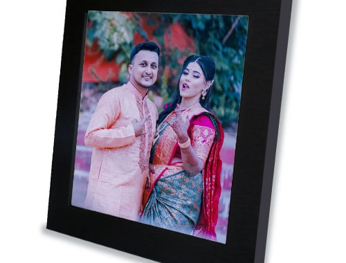 A personalized Indian marriage photo frame with a couple in traditional attire.