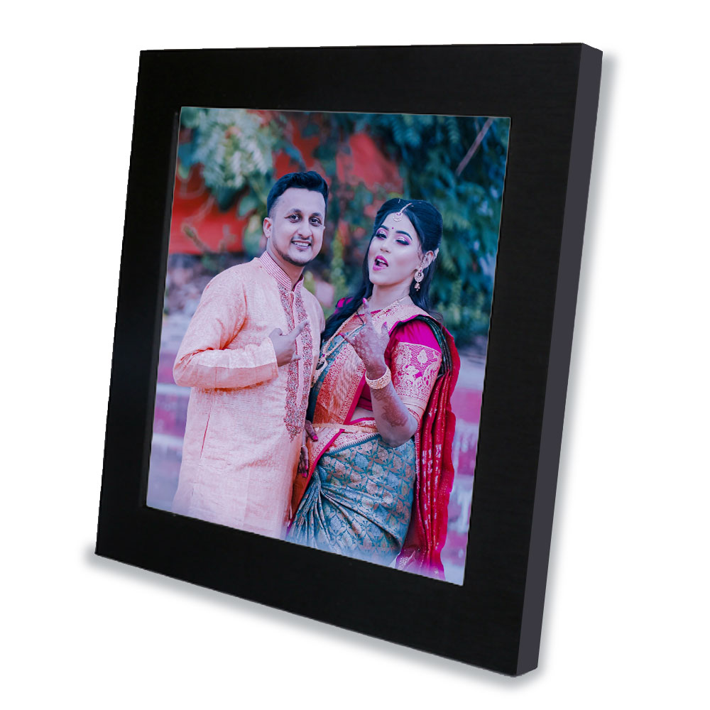 A personalized Indian marriage photo frame with a couple in traditional attire.