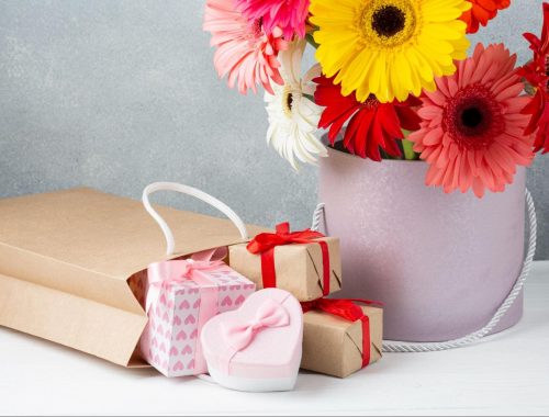 Cheerful flower bouquet with gifts for International Women's Day in India