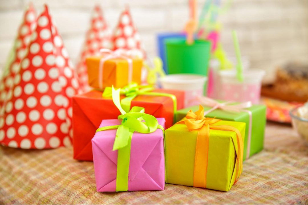 Party hats and colorful gifts for Birthday Return Gift Ideas