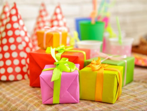 Party hats and colorful gifts for Birthday Return Gift Ideas