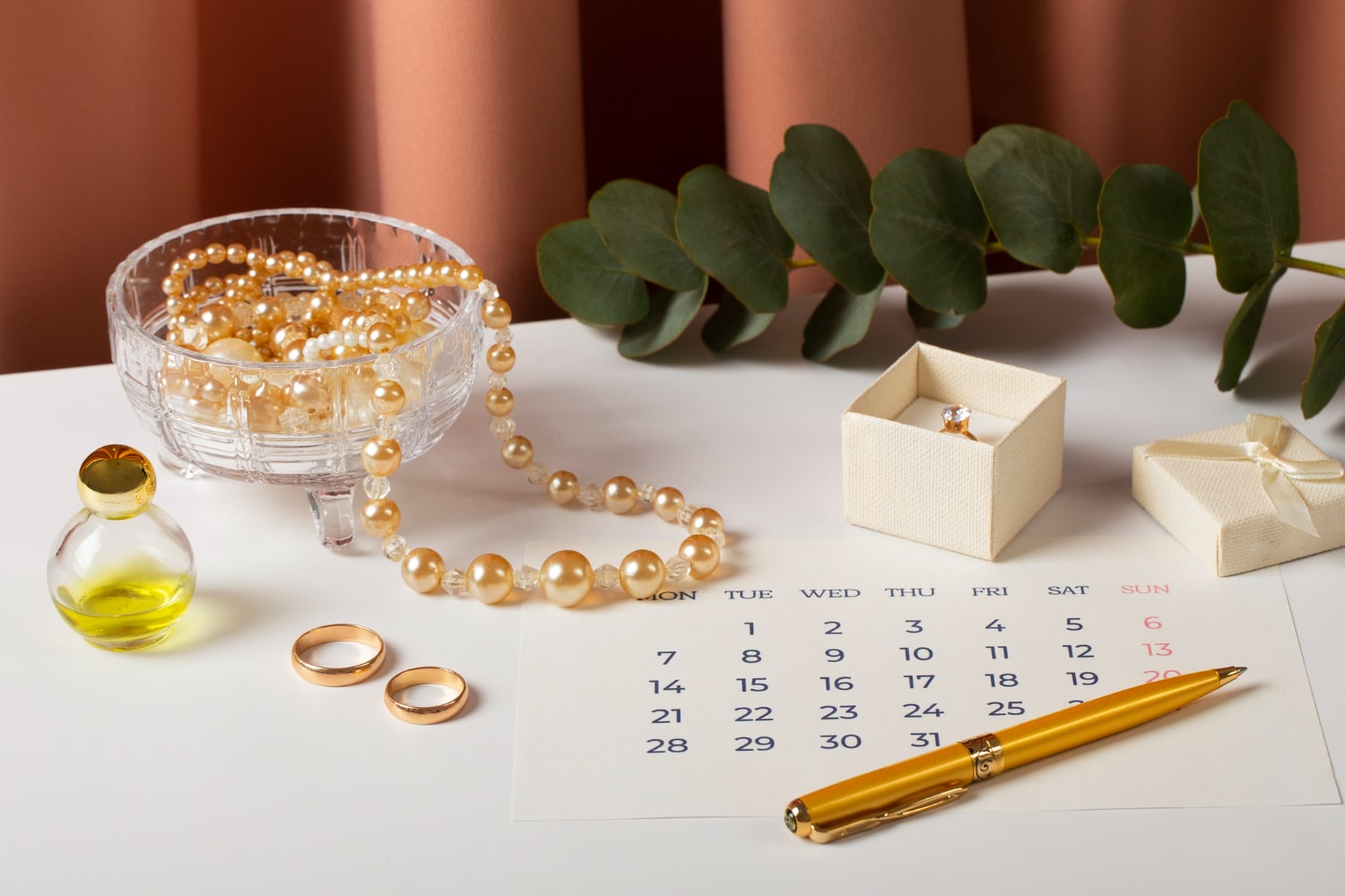 Elegant wedding gift setting with rings and calendar for anniversary.