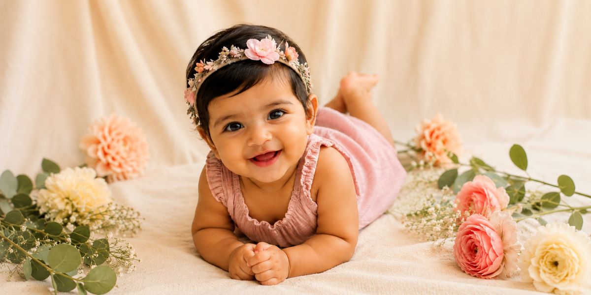 Floral 6 month baby photoshoot idea at home with pastel flowers