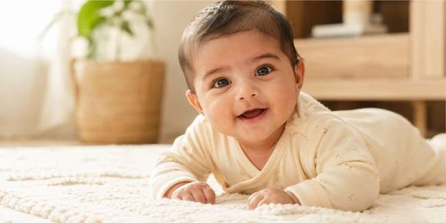3 month old baby during tummy time photoshoot at home