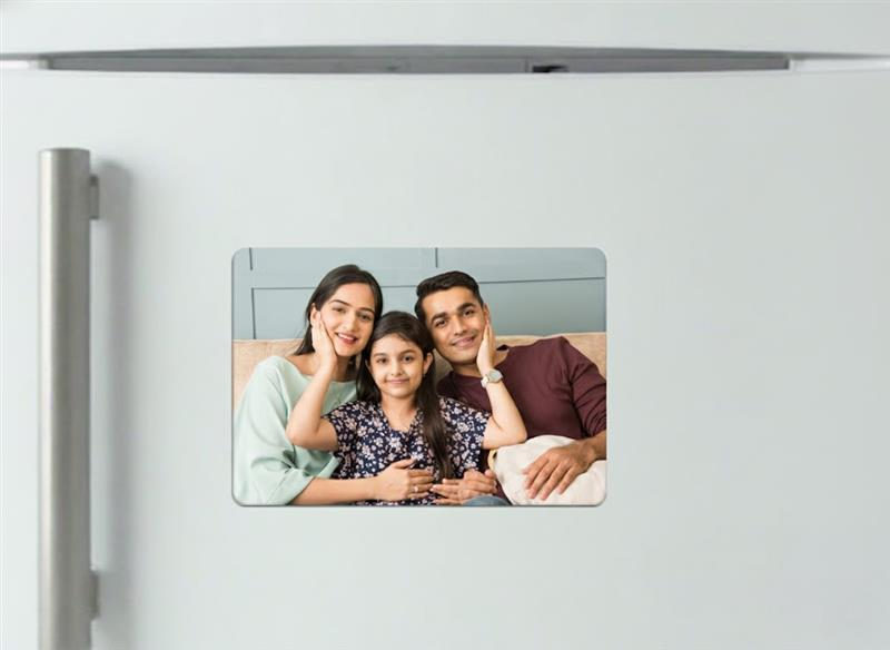 Rectangular family photo magnet displayed on a fridge door